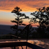 Sunset on the deck of Ebb and Flow Getaways Luxury Mountain Vacation Rental in Georgia